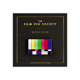 Color test pattern pin on a black card with 'The Film Pin Society' branding.