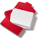 Red napkins with a stack of white cards on a white background