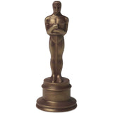 chocolate oscar statue on a white background. Indulge in the Oscars® x AndSons chocolate statuette, a luxurious treat for film lovers! Handcrafted with ethically sourced cacao and dusted with gold.