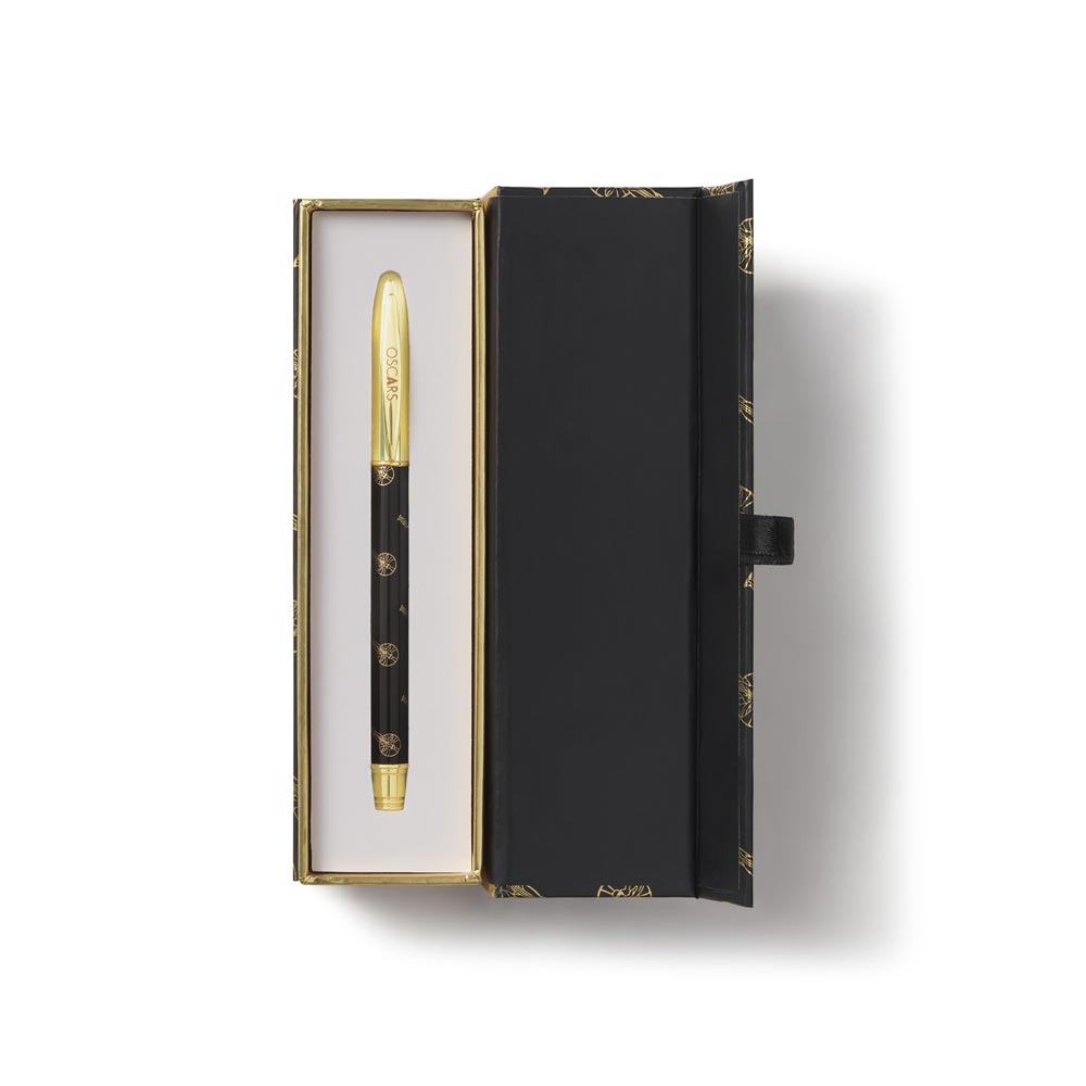 Black gift box open with a ballpoint pen decorated with the Oscars Logo and a gold pen cap.