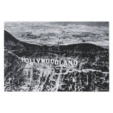 Black and white aerial view of the Hollywood sign with 'HOLLYWOODLAND' text.