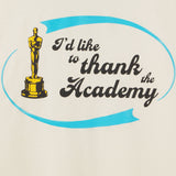 Oscar statue with text 'I'd like to thank the Academy' on a beige background