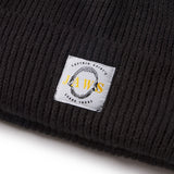 Black knit beanie with a 'Jaws' logo label on a white background