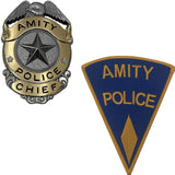 Amity Police Chief badge and patch on a white background from the movie JAWS (1975) for the 50th Anniversary of the film this is a limited edition officially licensed prop replica