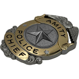 Metallic police chief badge with star design on a white background from the movie JAWS (1975) for the 50th Anniversary of the film this is a limited edition officially licensed prop replica