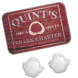 Red tin labeled 'Quint's Orca Mints Shark Charter' with two white mints on a white background