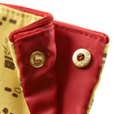 Red fabric with gold buttons on a yellow background. Embrace the magic of Studio Ghibli with Kiki's Delivery Service Pen Case! Adorable design, ample storage, and a touch of whimsy for your essentials.