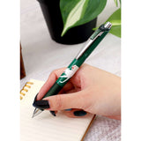 Hand holding a green pen with a cat design on a notebook. Studio Ghibli Green Princess Mononoke Ballpoint Pen (San &amp; the Forest Spirit) 