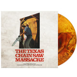 Vinyl record with 'The Texas Chain Saw Massacre' cover featuring a person with a chainsaw.