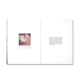 Open book with a photograph and text on a white background