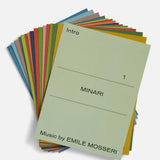 Colorful booklets with 'Minari' and 'Emile Mosseri' text on a white background