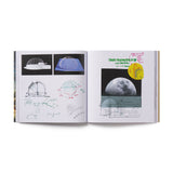 Open book showing architectural drawings and diagrams on a white background