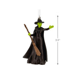 Decorative ornament of a Elphaba with a broomstick on a white background