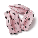 Pink pouch with black roach pattern on a white background inspired by John Waters' film Hairspray.