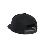 Black cap with a brand logo on the back against a white background