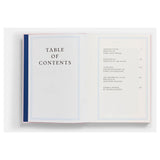 Open book showing a table of contents on a white background