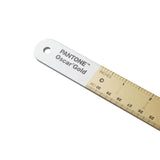 Pantone Oscar Gold measuring tape on a white background