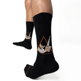 Black socks with abstract designs on a white background