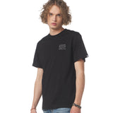 Man wearing a black t-shirt with text on a white background