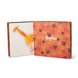 Greeting card with a giraffe illustration on an orange floral patterned box