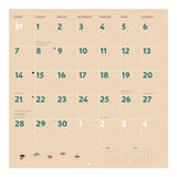 Calendar with beige background and green numbers