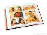Open book showing animated comic pages with characters and scenes from the Studio Ghibli movie by Hayao Miyazaki Spirited Away